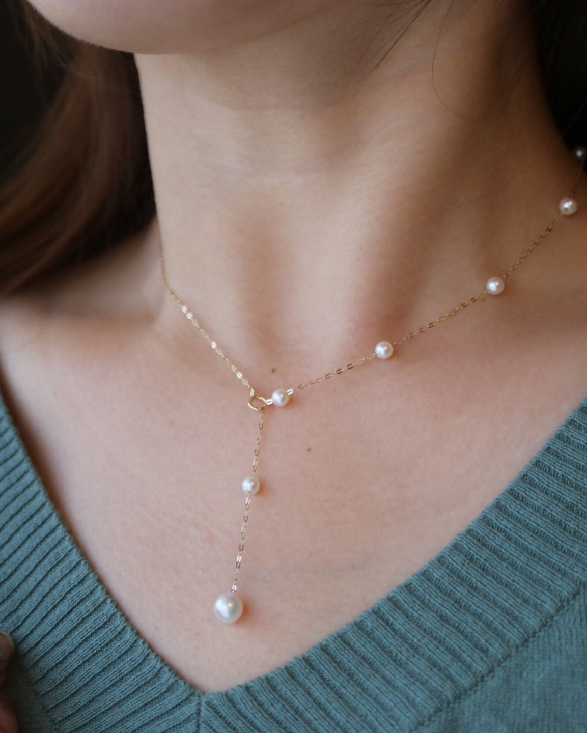 Model Wearing 18K Gold Akoya Pearl Station Necklace – Elegant Look