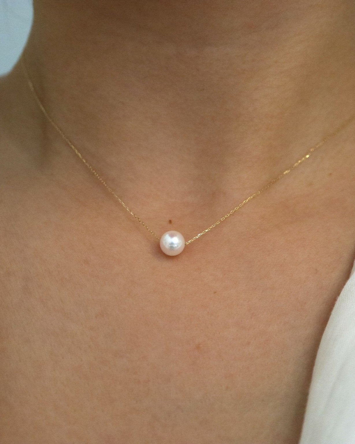 Side View of Model Wearing Japanese Akoya Floating Pearl Necklace - 3