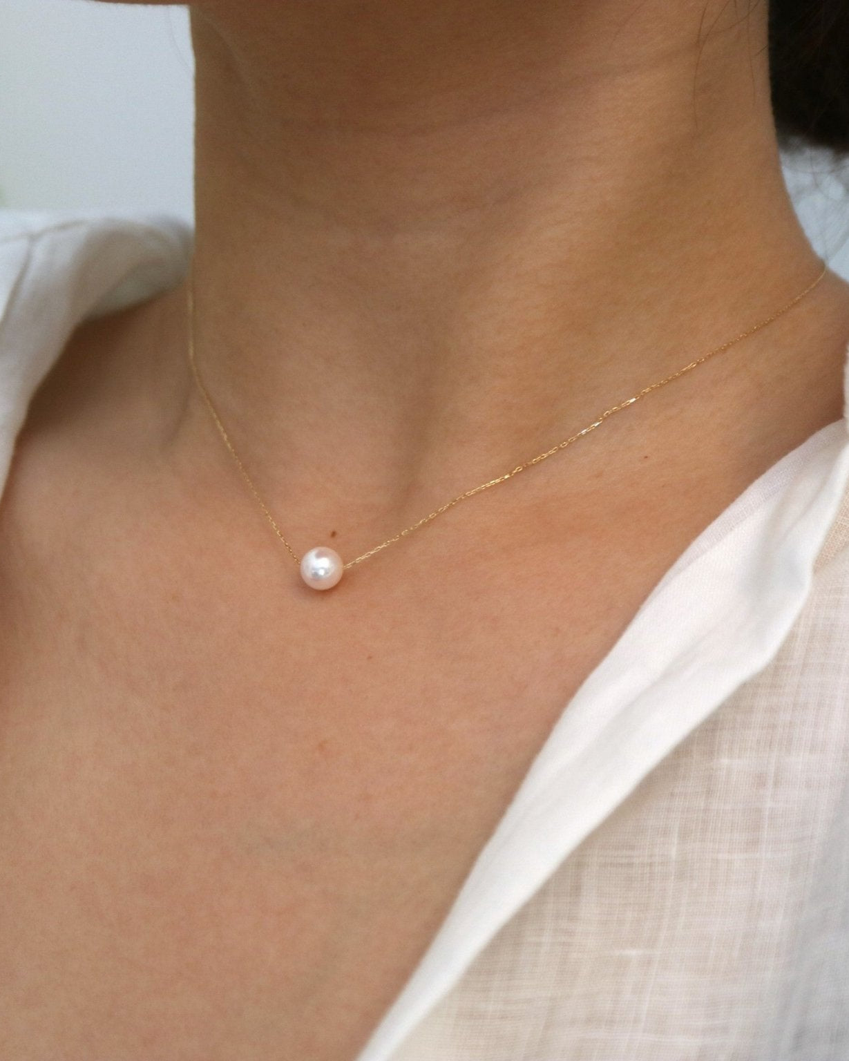 Side View of Model Wearing Japanese Akoya Floating Pearl Necklace - 2