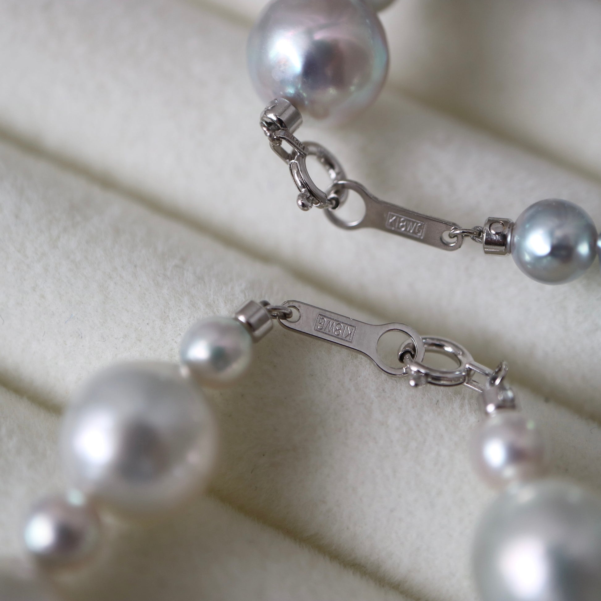 Japanese Akoya pearl necklace with 18K white gold clasp, showcasing lustrous seawater pearls and fine craftsmanship.