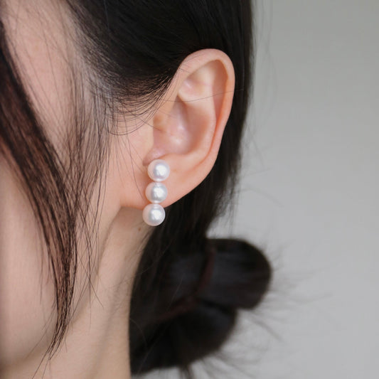 Three pearl drop earrings on ear, handmade Japanese Akoya pearls, elegant minimalist design