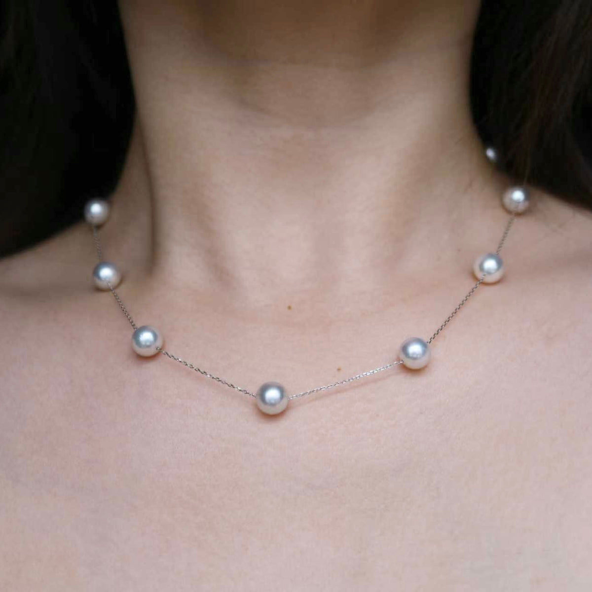 Elegant Akoya pearl necklace with lustrous pearls on a delicate chain, perfect for timeless elegance.