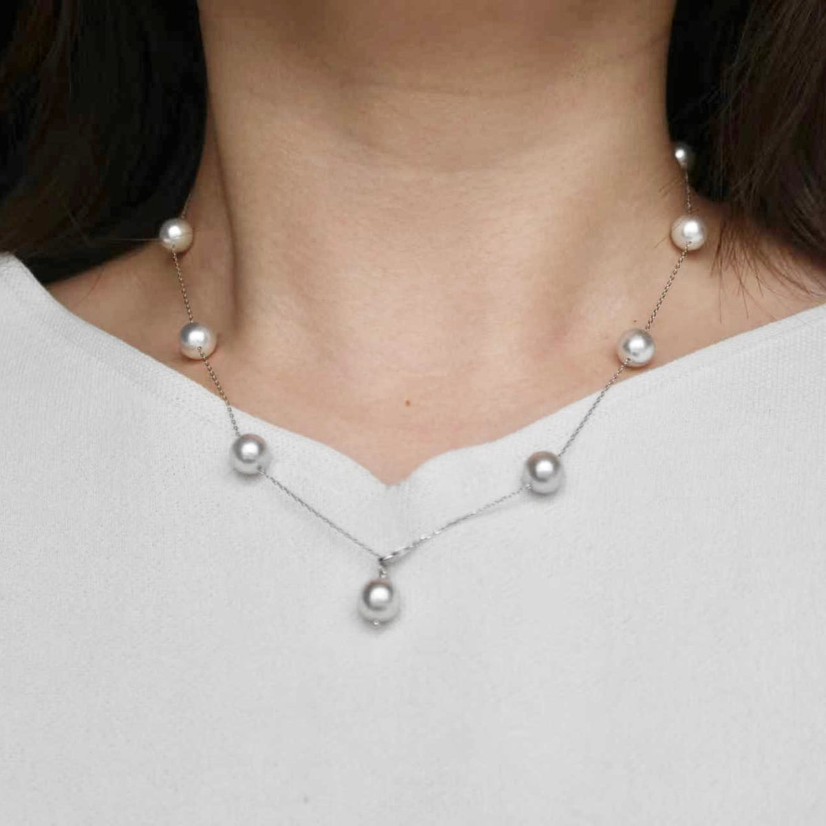 Elegant Akoya pearl necklace with delicate chain and lustrous pearls, perfect for everyday wear.