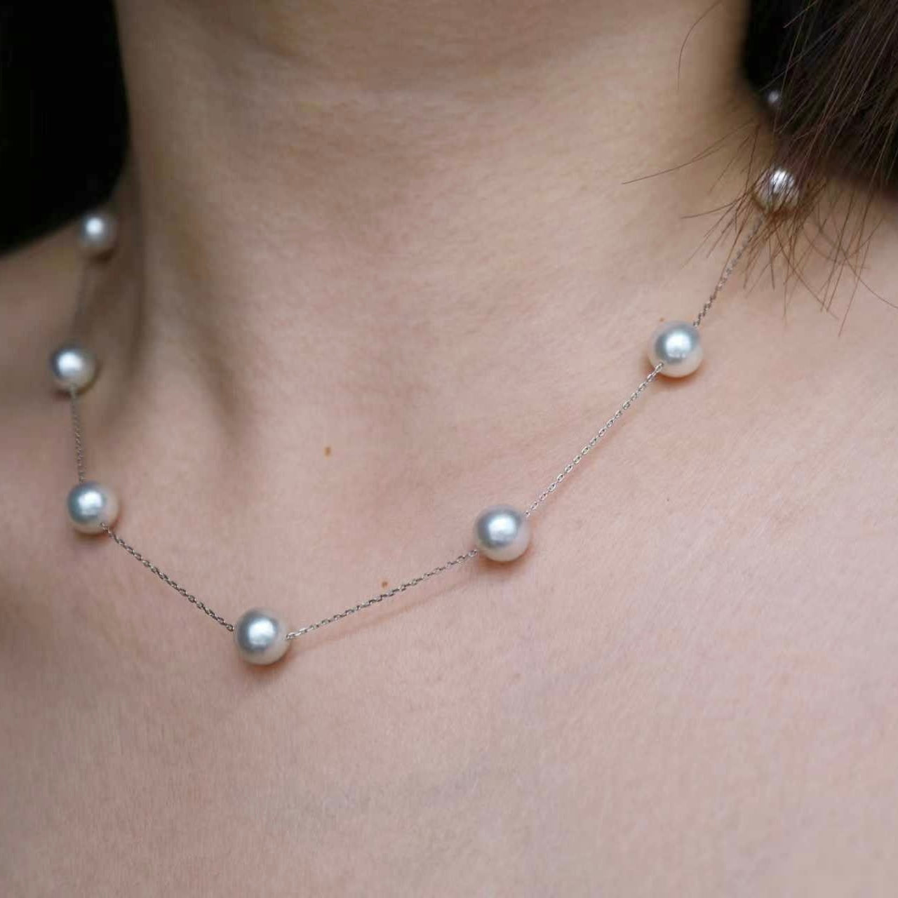 Elegant Akoya pearl necklace with lustrous pearls on a delicate chain, perfect for timeless elegance.