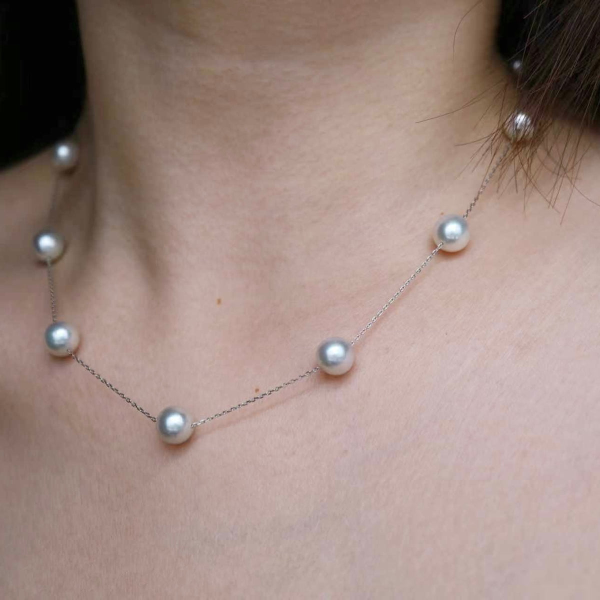 Elegant Akoya pearl necklace with lustrous pearls on a delicate chain, perfect for timeless elegance.