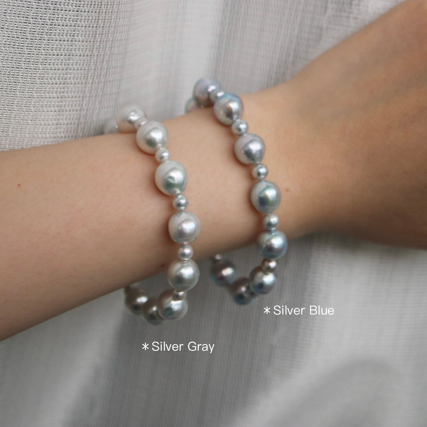 Silver Gray and Silver Blue Akoya pearl bracelets on wrist, handmade Japanese seawater pearls