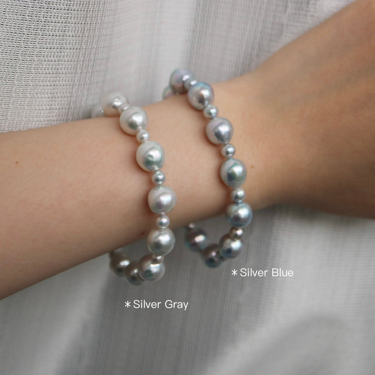 Silver Gray and Silver Blue Akoya pearl bracelets on wrist, handmade Japanese seawater pearls